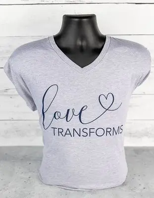 Gray Love Transforms V-neck T-shirt supporting trafficking survivors
