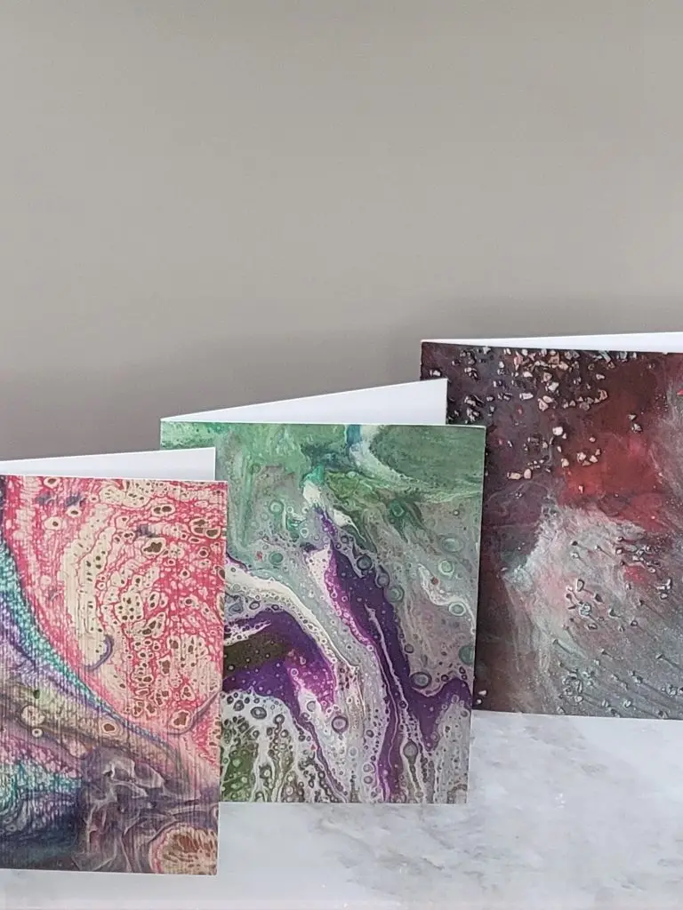 Three Hope Against Trafficking greeting cards featuring original survivor artwork